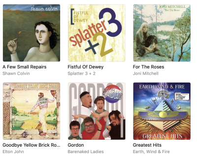 A screenshot from iTunes showing album covers by Shawn Colvin, Joni Mitchell, Splatter Trio, and Earth, Wind and Fire